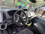 Dashboard of a Ford Transit RV rental van, featuring steering wheel, odometer (194k miles), and phone mount.