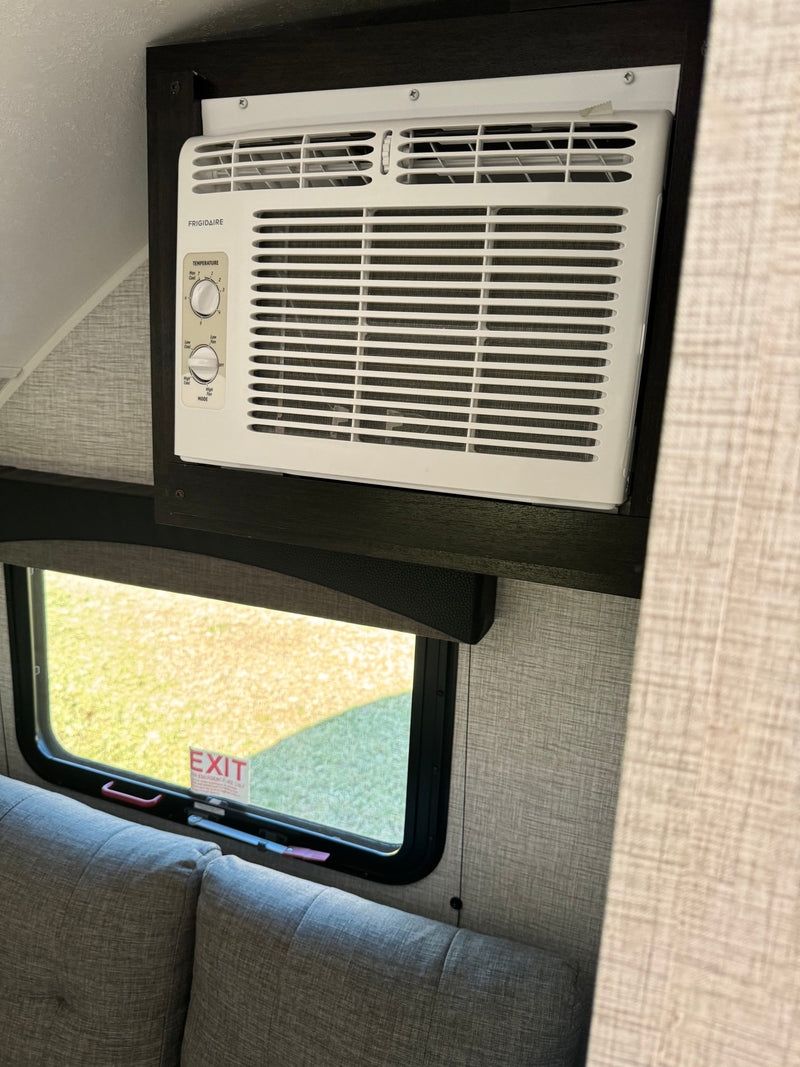  ready for outdoor adventures.|Cozy RV rental dinette with grey upholstered benches — photo 3
