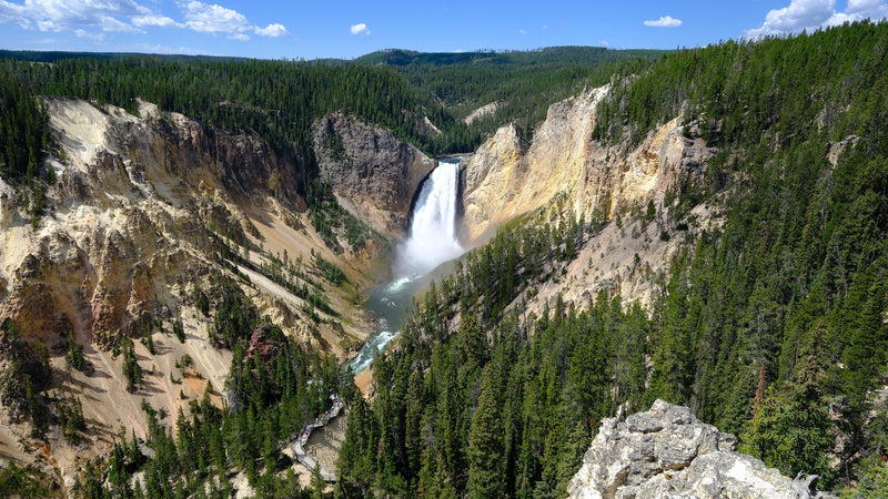  with mountains & fields beyond. Ideal for your RV rental adventure!|Explore Yellowstone's colorful Mammoth Hot Springs travertine terraces. An RV rental makes this natural wonder accessible!|Experience Yellowstone's majestic Lower Falls — photo 13