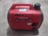 This portable red Honda EU2000i inverter generator provides reliable power, perfect for your RV rental adventures.