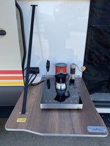 RV rental outdoor coffee setup featuring a DuxTop induction cooktop, Bialetti Moka pot, and grinder for roadside brews.