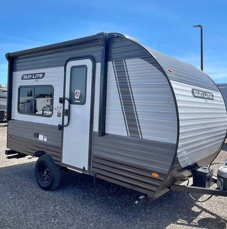Compact gray Sun Lite LTD travel trailer