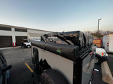 A Boreas XT overland trailer equipped with a Freespirit rooftop tent, ready for your next RV rental journey.