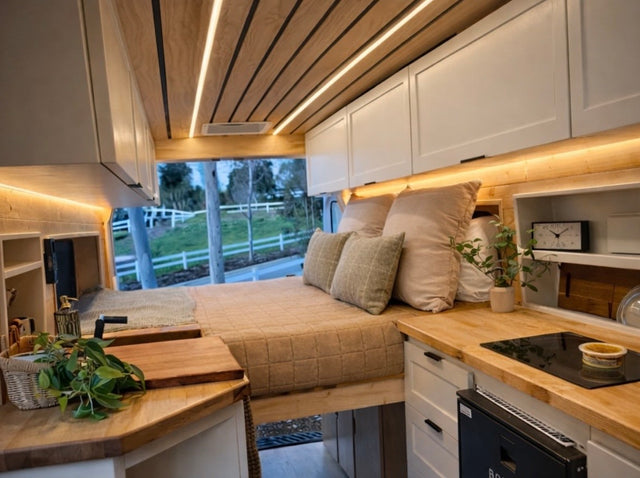  ideal for an RV rental getaway.|Cozy RV rental interior with a comfy bed
