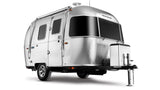 A sleek, silver Airstream travel trailer, perfect for your next rv rental adventure. Iconic rounded design with large tinted windows.