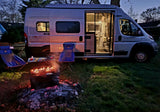 Cozy night by the campfire with an RV rental. Perfect outdoor escape under the stars.