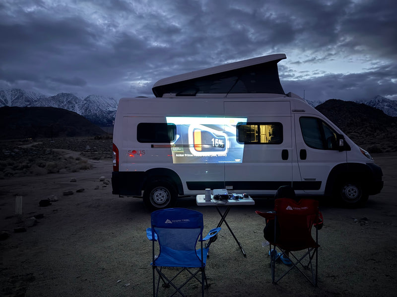  parked on a sunny concrete drive.|Cozy rv rental interior: kitchen with sink/stovetop — photo 4
