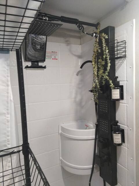  and smart devices for a comfortable stay.|Enjoy a modern RV rental shower! Features a rain shower