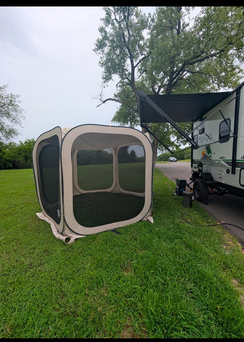 Camping with an RV rental: A screen tent is pitched beside a travel trailer with an extended awning on green grass. — photo 15