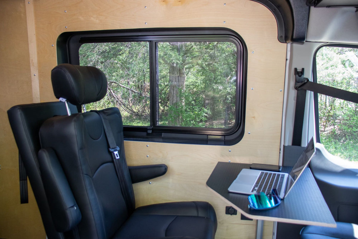  and comfortable sleeping area. Ready for adventure!|Explore this modern RV rental: A custom camper van interior featuring kitchen — photo 20