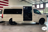 White luxury Sprinter van, side door open to reveal spacious custom interior. Ideal for rv rental adventures.