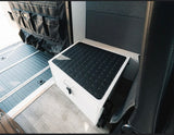 Practical RV rental interior features durable floor mats, a versatile storage step, and a door organizer for efficient space.