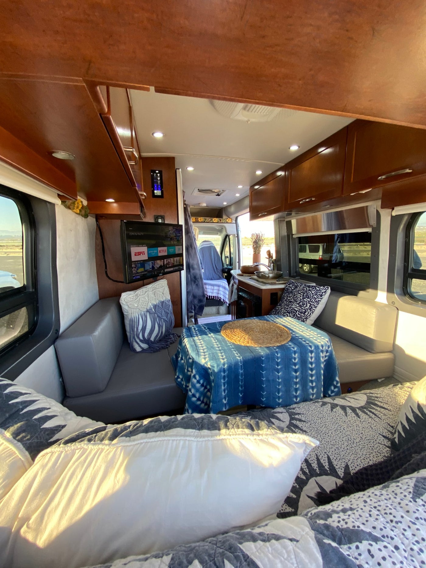  featuring a compact kitchen and elegant table settings.|Cozy RV rental bathroom with toilet — photo 5