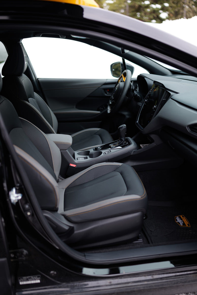 Modern vehicle interior: two-tone seats, tech display, and shifter. Ready for snowy roads and your RV rental adventure. — photo 14