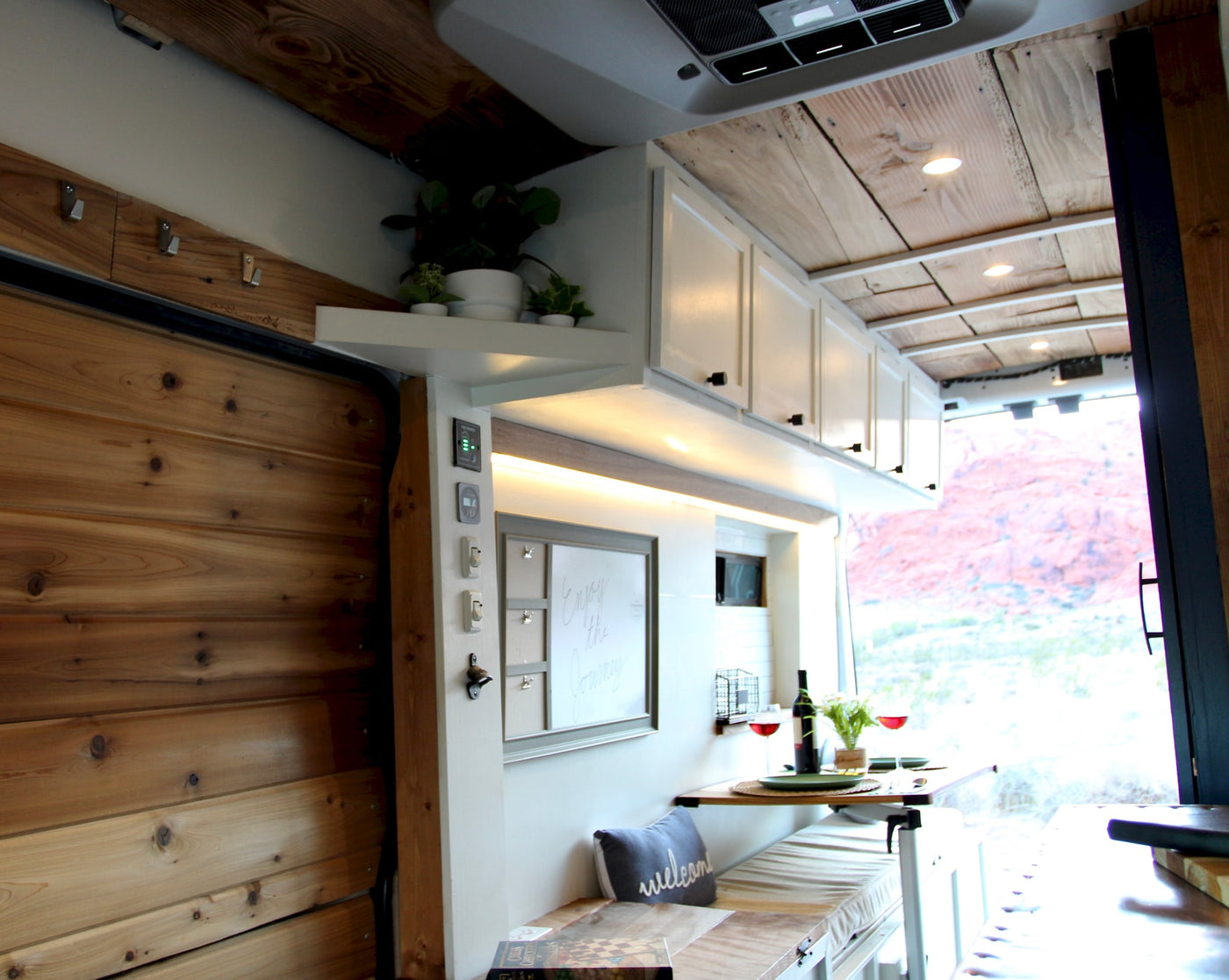 Experience freedom in this RV rental! Enjoy a well-appointed interior with dining, bench seating, and scenic desert views. — photo 5