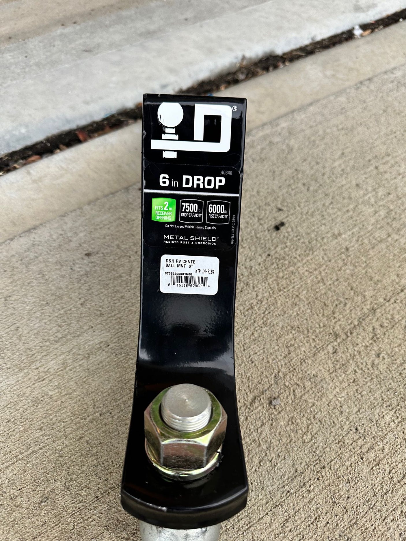 A black 6-inch drop hitch ball mount (7500lb capacity) for towing, essential equipment for an RV rental.