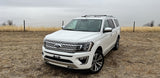 White Ford Expedition SUV for spacious trips. A versatile alternative or companion to your next rv rental adventure.