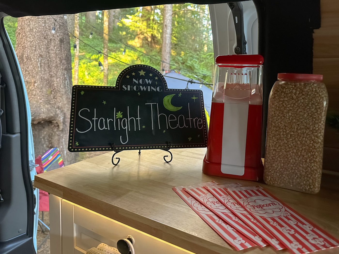  and a serene nature view outside.|Cozy rv rental interior with organized kitchen drawers — photo 8