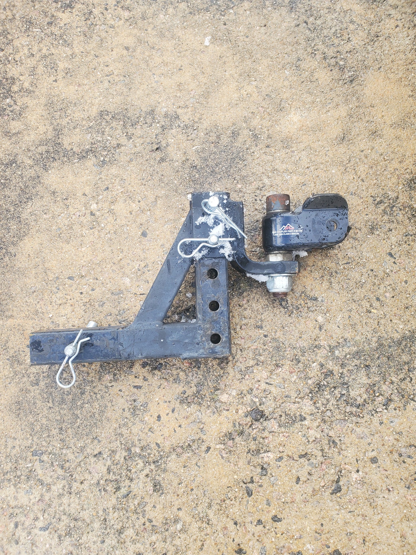 Black 8000lb trailer hitch & ball mount, ideal for RV rental adventures. Secure your tow safely!