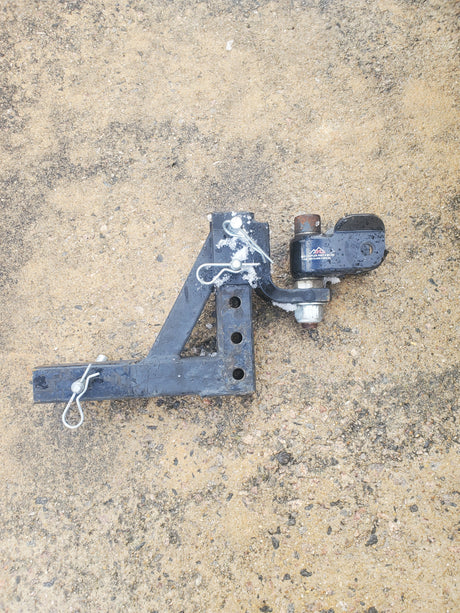 Black 8000lb trailer hitch & ball mount, ideal for RV rental adventures. Secure your tow safely!