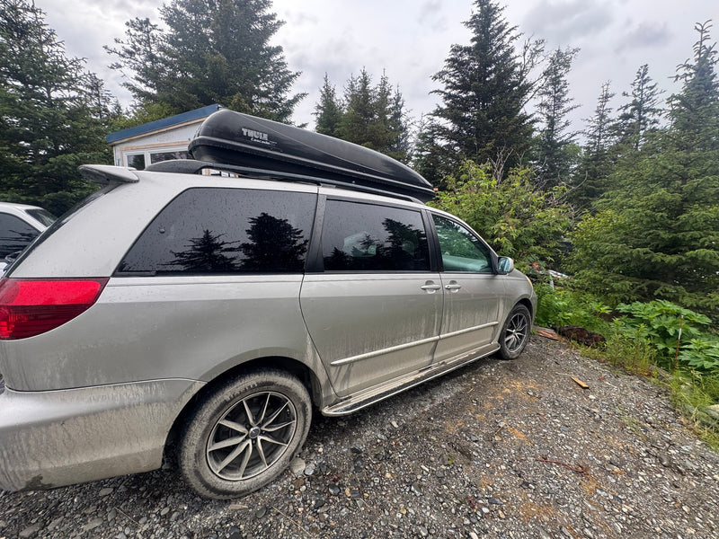  a DIY wooden bed platform with plaid bedding offers a cozy sleep setup — photo 4