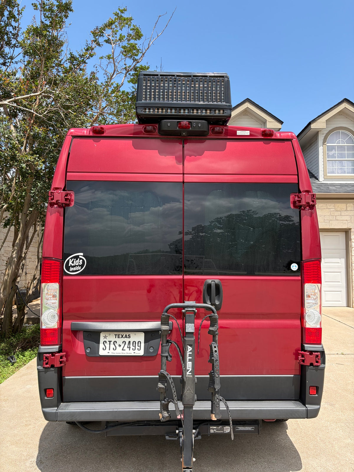 Red camper van with bike rack and rooftop unit, ready for your next rv rental adventure. — photo 5