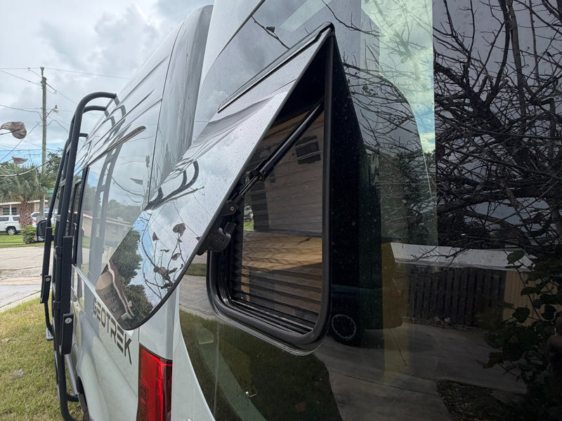  and a compact kitchen.|Custom RV rental interior with bamboo ceiling — photo 11