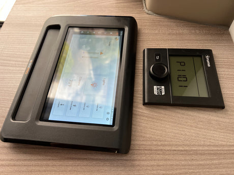 RV rental control panels: A BMPRO touchscreen for climate, lights & tanks, and a Truma iNet heating unit are shown.