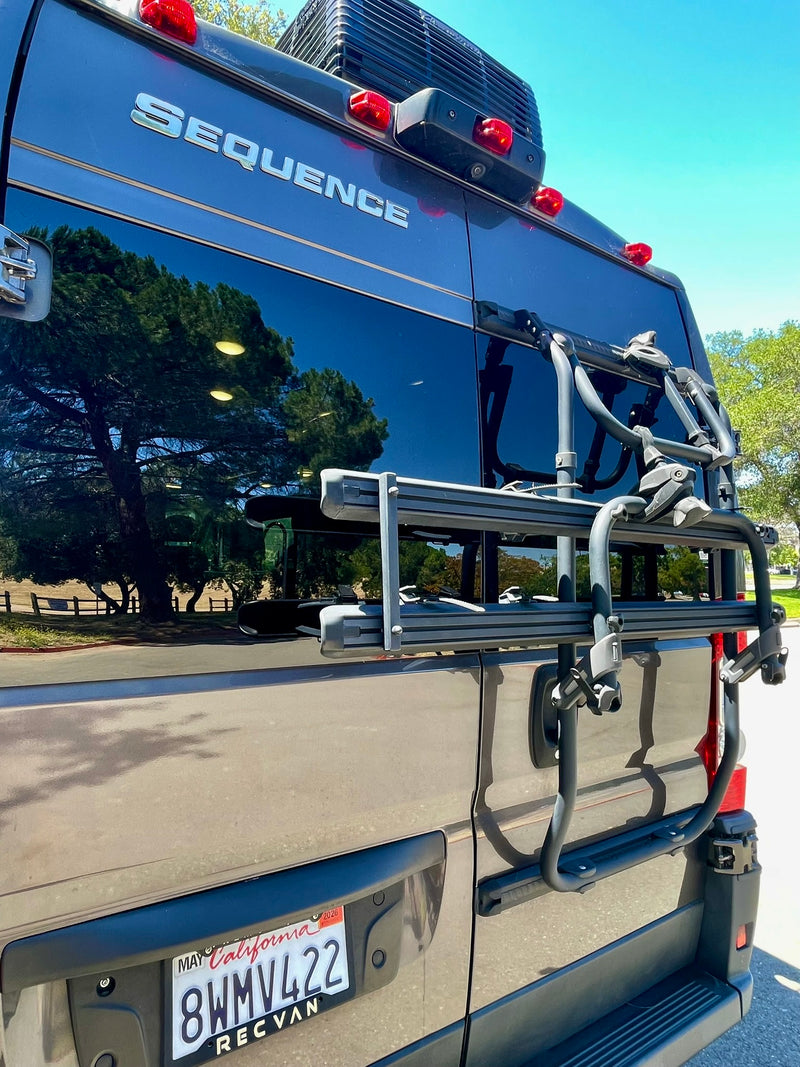  parked outdoors. Great for an rv rental adventure or travel.|Rear view of a gray SEQUENCE RV rental van with a Thule bike rack and a California license plate — photo 7