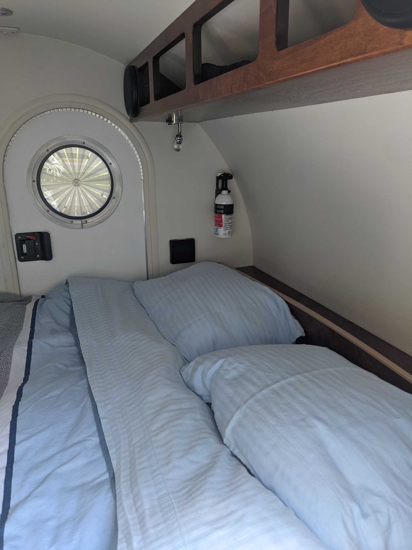  and a dog.|Inside an RV rental's cozy awning: a patterned rug — photo 7