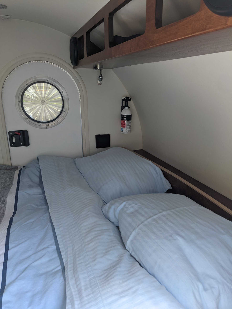  and a dog.|Inside an RV rental's cozy awning: a patterned rug — photo 7