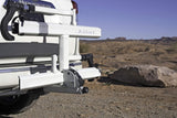 Vehicle's Kuat hitch bike rack, perfect for an rv rental outdoor adventure in rocky terrain.