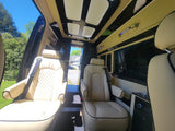 Step into luxury with this RV rental! Features cream leather captain seats, elegant ceiling lighting, and spacious interior.