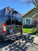 This Winnebago Travato RV rental, equipped with a bike rack, is ready for sunny day travels.
