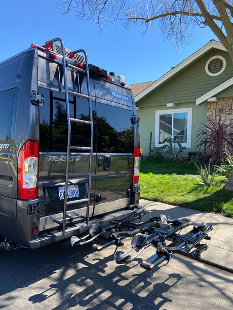 This Winnebago Travato RV rental, equipped with a bike rack, is ready for sunny day travels.