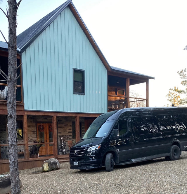  a black Mercedes Sprinter van