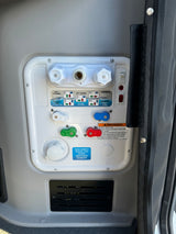 An RV rental's Nautilus P4 water system panel, showing controls for tank fill, city water, and winterizing.