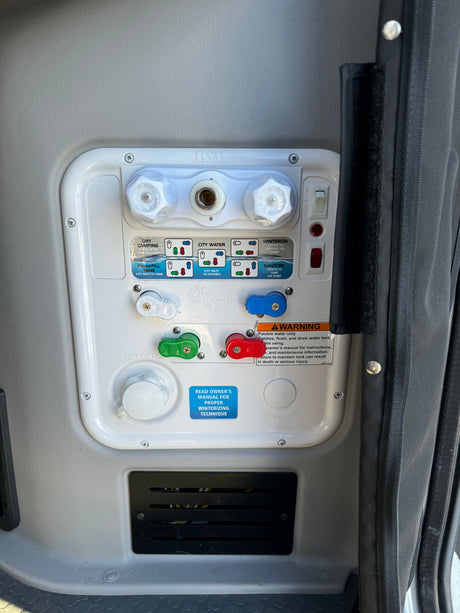 An RV rental's Nautilus P4 water system panel, showing controls for tank fill, city water, and winterizing.