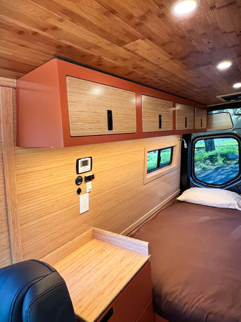  and wood finishes. Ready for your next adventure!|Modern RV rental kitchen with a sink — photo 18