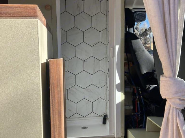 compact bathroom with stylish hexagonal tiles