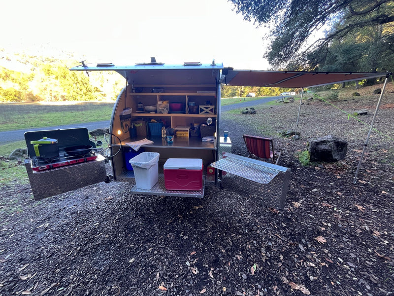  and ambient lights. Perfect outdoor adventure.|This RV rental teardrop trailer displays its organized galley kitchen — photo 10