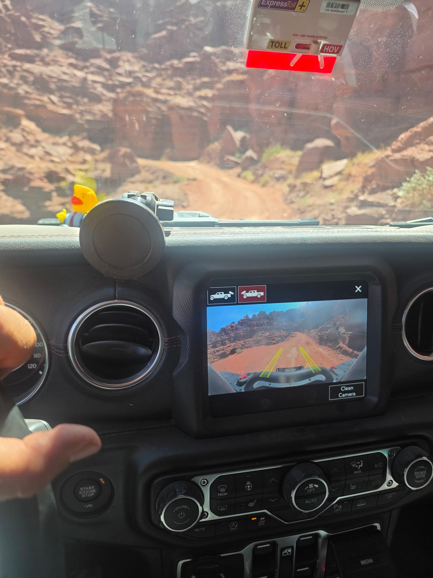 Off-road vehicle dashboard shows camera view of a desert trail. An adventure idea for your next rv rental getaway!