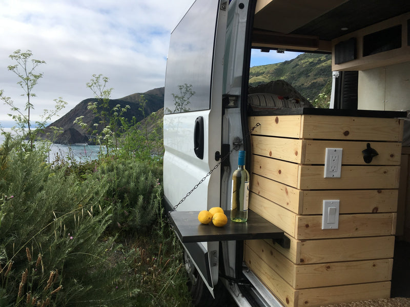  side door open to reveal a custom interior with pull-out table — photo 9