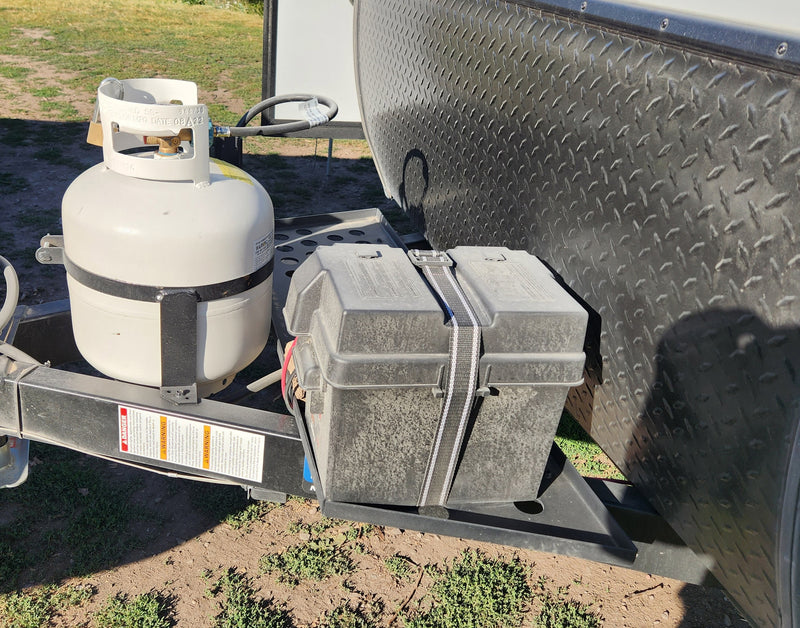 RV rental: Essential propane tank (mfg 08/22) and battery box setup on a travel trailer hitch. — photo 16