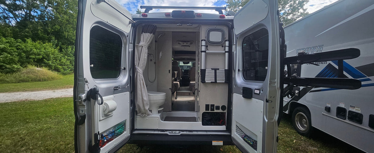  and a rear door.|RV rental's inviting interior: two long — photo 10