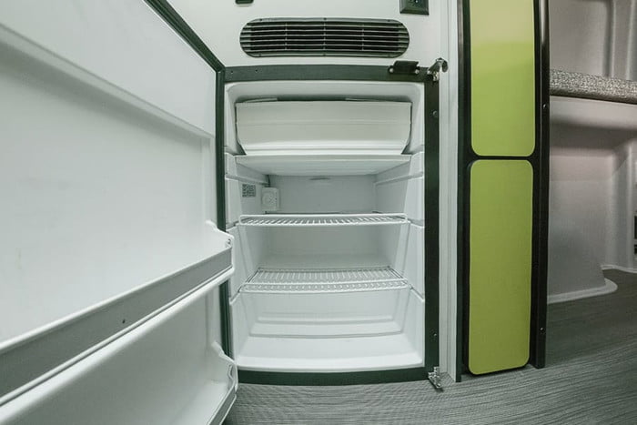  perfect for off-road travel.|This spacious RV rental interior features a functional kitchen — photo 16