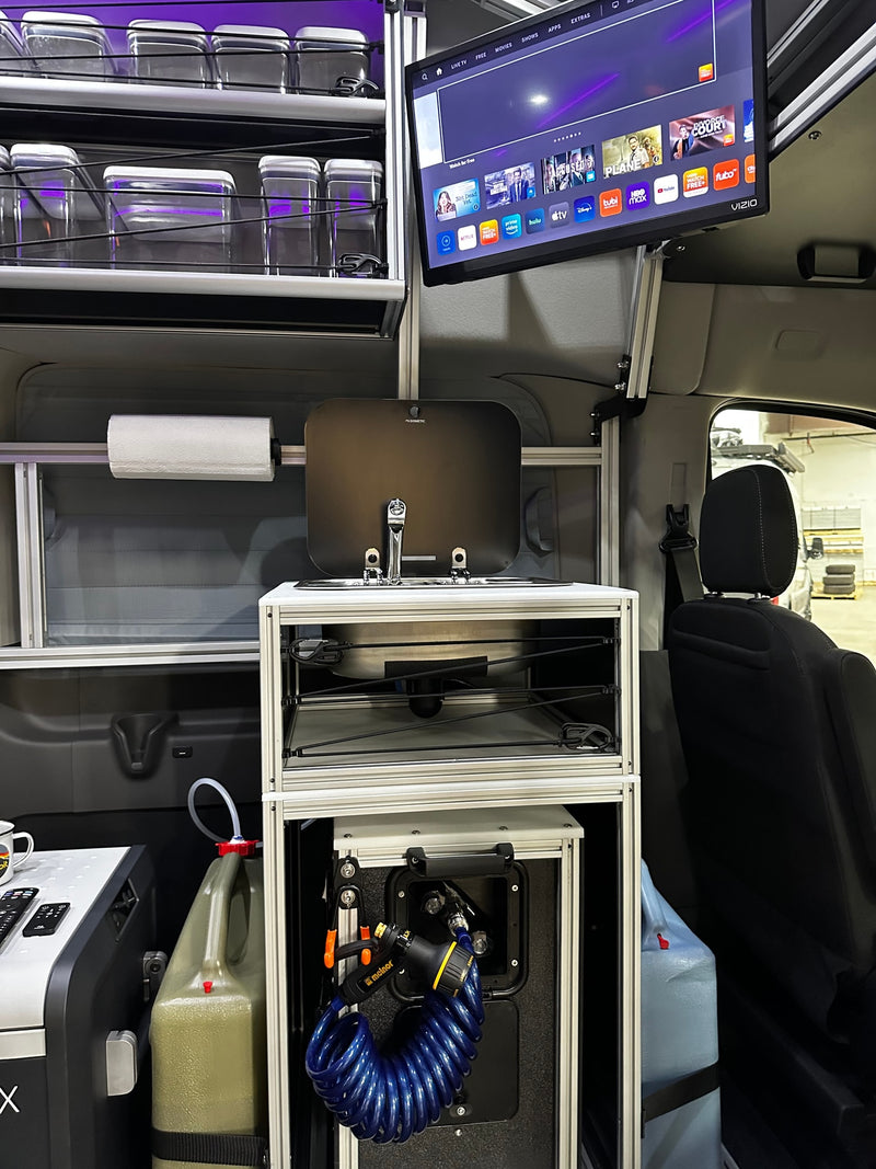  and vibrant purple accent lighting.|Spacious rv rental van interior featuring comfortable passenger seating and practical modular storage shelves.|RV rental: Inside a camper van with custom aluminum shelving — photo 7