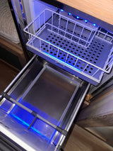 Isotherm RV rental refrigerator with bright blue LED lighting and convenient pull-out drawers for compact cooling storage.