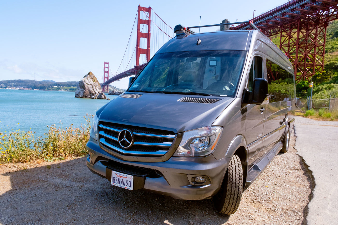 Explore San Francisco with this gray rv rental Sprinter van, parked with a stunning view of the Golden Gate Bridge. — photo 4