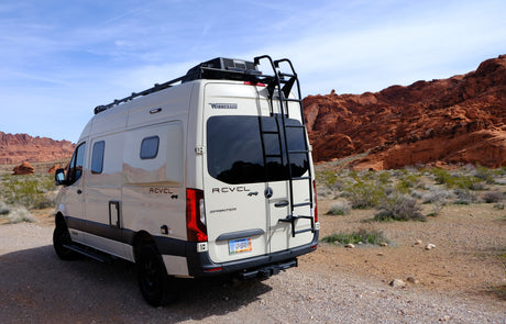 Winnebago Revel 4x4 Sprinter camper van, a perfect rv rental for desert adventures among red rock formations.